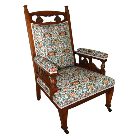 Arts & Crafts pomegranate carved armchair with Copes & Collinson castors - The Sitting Place
